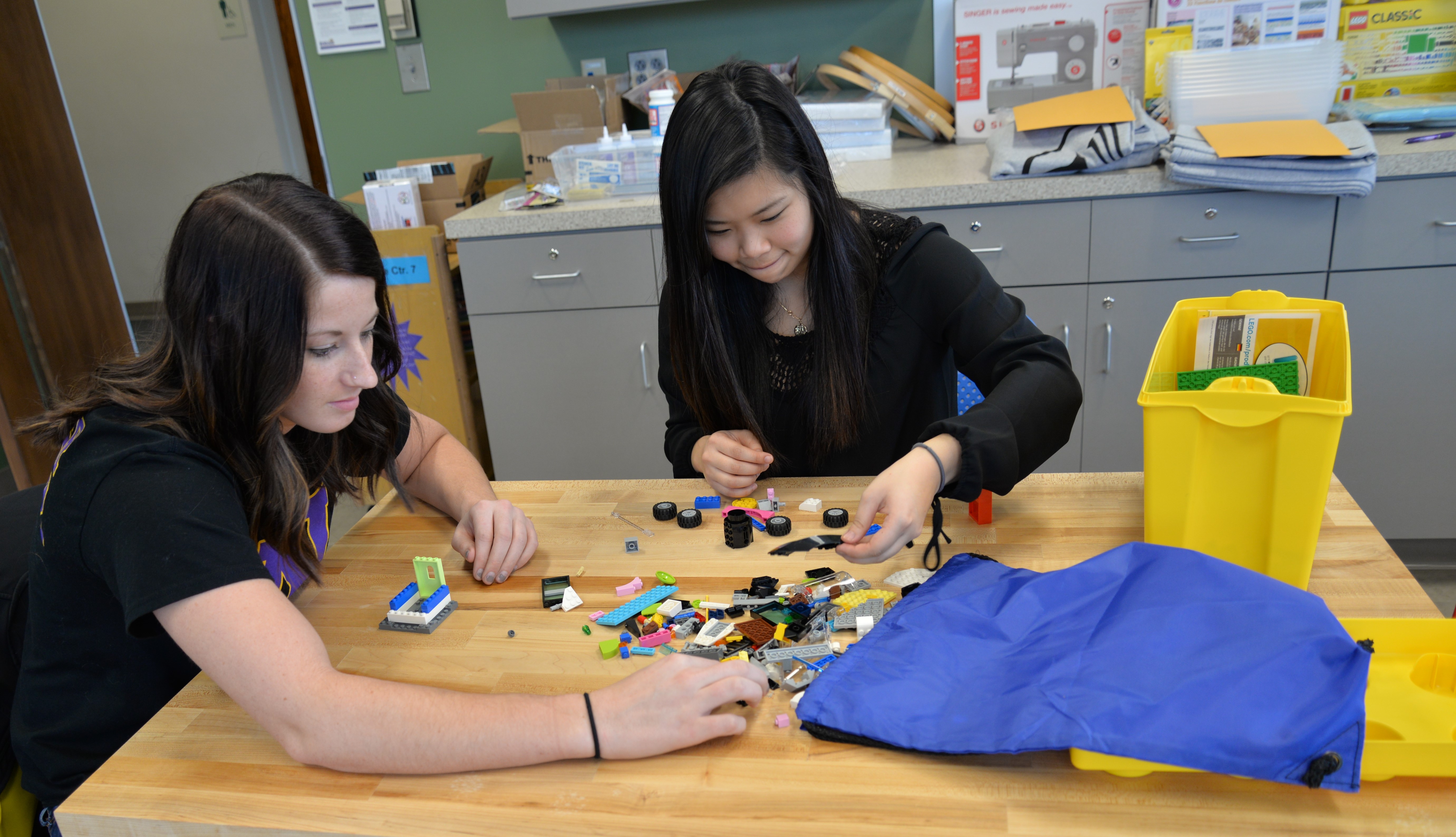 Two students building with Legos in the Rod Library Makerspace.